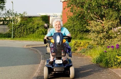 Elderly Lady on Mobility Scooter Rental